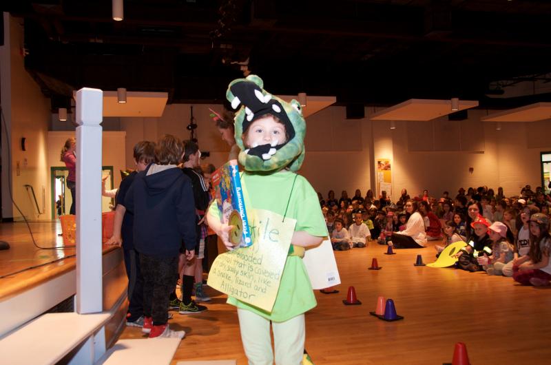 Reptilian second grader Jessa Bentz wins a dictionary in the Vocabulary Day raffle. BY GEORGIA SPARLING